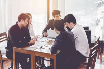 Start up.Asian Group businessman,Business woman and meeting planing to buy some property as an investment.