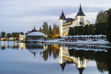 Evening facade of the tourist complex against the background of the lake