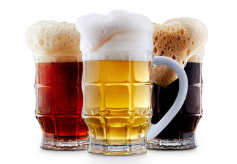 Mug collection of frosty dark red and light beer with foam isolated on a white background