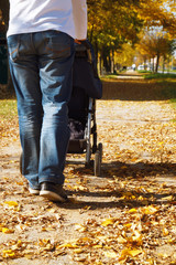 A man walking with buggy