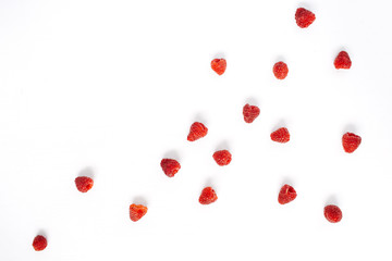 Raspberries on white background. Food blog or magazine concept texture.