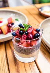 Chia seed pudding breakfast with summer berries. Healthy food concept.