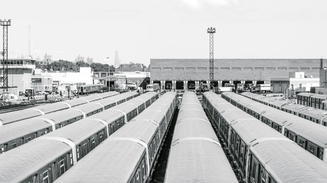 Black and white photo of a subway train depot in New York City - Powered by Adobe