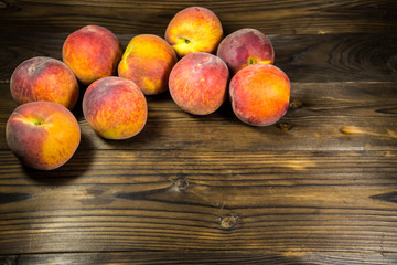 Ripe peaches on wooden table