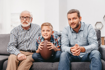 Family watching football at home