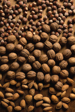 Background with walnuts, hazelnuts and almonds