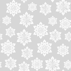 Winter seamless pattern. Snowflakes on a gray background. For your design.