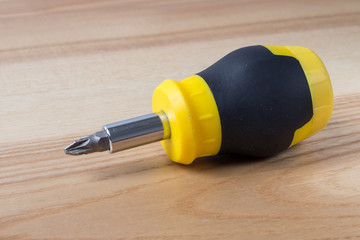 Screwdriver on wooden table