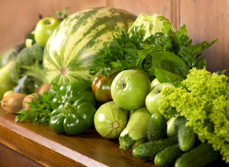 Green vegetables a wooden background
