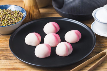 Obraz na płótnie Canvas A peach-shaped birthday bun known as the Longevity Peach.Chinese specialty pastry