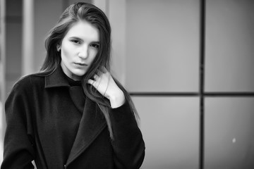 Girl in a coat black and white photo