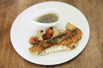 Sea bass fillet on wood background