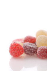 Colorful jelly sugar candies close up isolated in white background