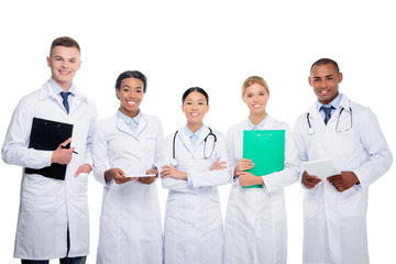 multiethnic doctors with stethoscopes, clipboard and tablet