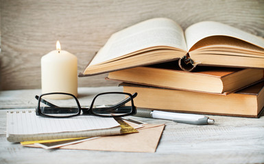 Books and notepad for notes The concept of education, recreation and relaxation. The style is retro.