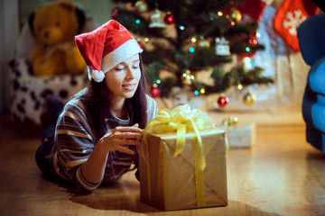 the girl in a hat with a gift