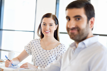 Fototapeta premium Image of two young business people in office