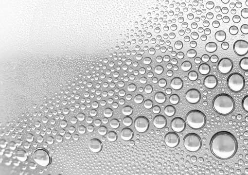 Closeup microphotograph of water droplets condensed inside a plastic bottle