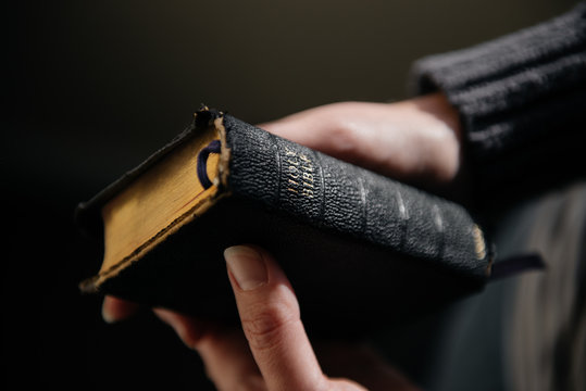 Woman holding bible