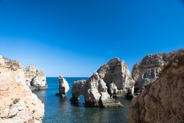 Fototapeta na wymiar Cliff coastline in Lagos, Algarve, Portugal