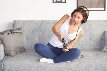  girl playing with a joystick in her hands enthusiastically