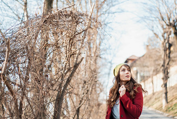 Urban lifestyle fashion portrait of stylish young girl walking on the autumn city.