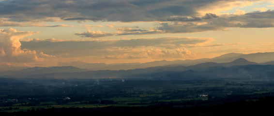 countryside field with twilight sky and clouds at morning before sunrise.