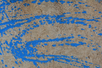 blue watercolor paint on dirty gypsum board