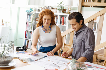 Fototapeta premium Two young architects in office