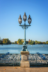 Old vintage street lamp on the lake of Enghien les Bains near Paris, France