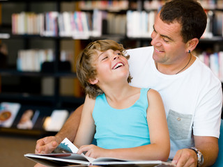 Father with son in library