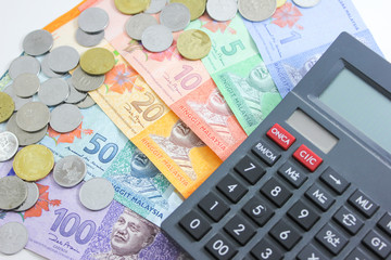 Malaysia bank note ringgit and calculator in white background