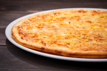 pizza on the wooden background