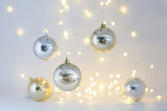 Beautiful Gold and Silver Christmas ornaments and Christmas light background.