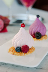 White soufle cake on white ceramic plate at restaurant.