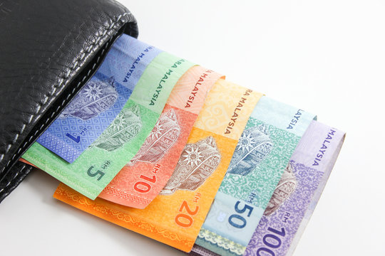 Black Wallet with Malaysia ringgit bank notes isolated on white background