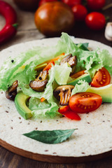 Natural vegetarian mexican food - fresh salad on tortilla bread.