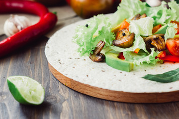 Natural vegetarian mexican food - fresh salad on tortilla bread.