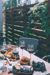 red wine with various snacks