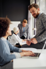 Fototapeta premium Multi-ethnic team working in modern office