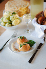 Ukarnian food - round pastries pampushki on ceramic plate.