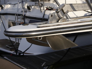 Embedded anchor in the bug gangway, Recreational boats in the background.