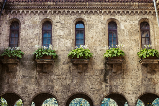 Architecture: windows on old stone building
