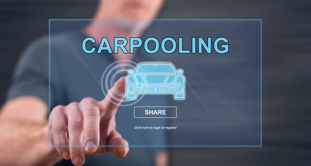 Man touching a carpooling concept on a touch screen