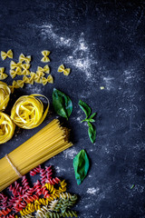 various kinds of paste on dark background top view