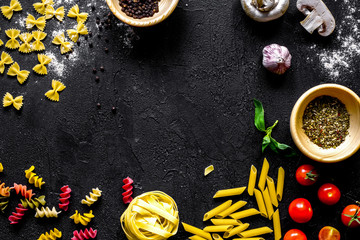 Obraz na płótnie Canvas ingredients for cooking paste on dark background top view