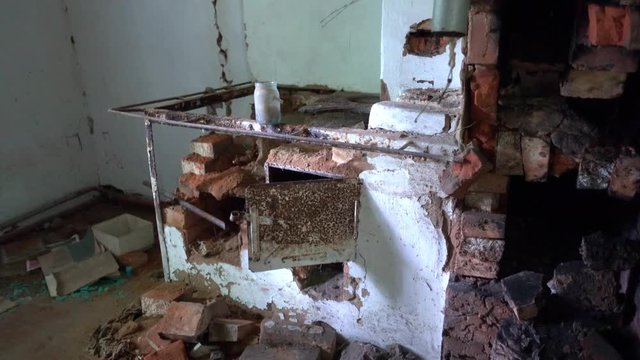 Chernobyl, Ukraine - 17th of June 2017: Visit to Zalesye village in Chernobyl zone - 4K Destroyed Russian stone stove in abandoned house