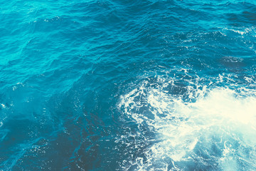 Fototapeta na wymiar Inspiration by the sea.Boiling seawater.Background shot of aqua sea water surface with space for text.Restless water, sea waves.Top view.Indonesia.