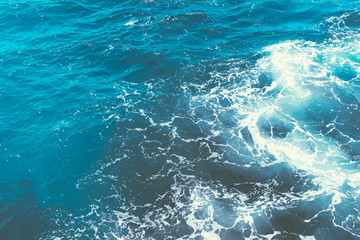 Inspiration by the sea.Boiling seawater.Background shot of aqua sea water surface with space for text.Restless water, sea waves.Top view.Indonesia.