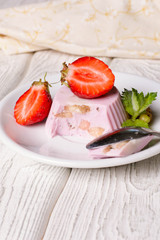 Panna cotta with blueberries jam and strawberries